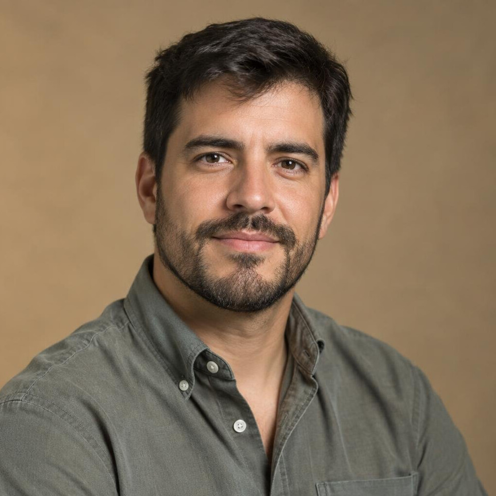 Studio portrait of a Hispanic man editor in his 30s