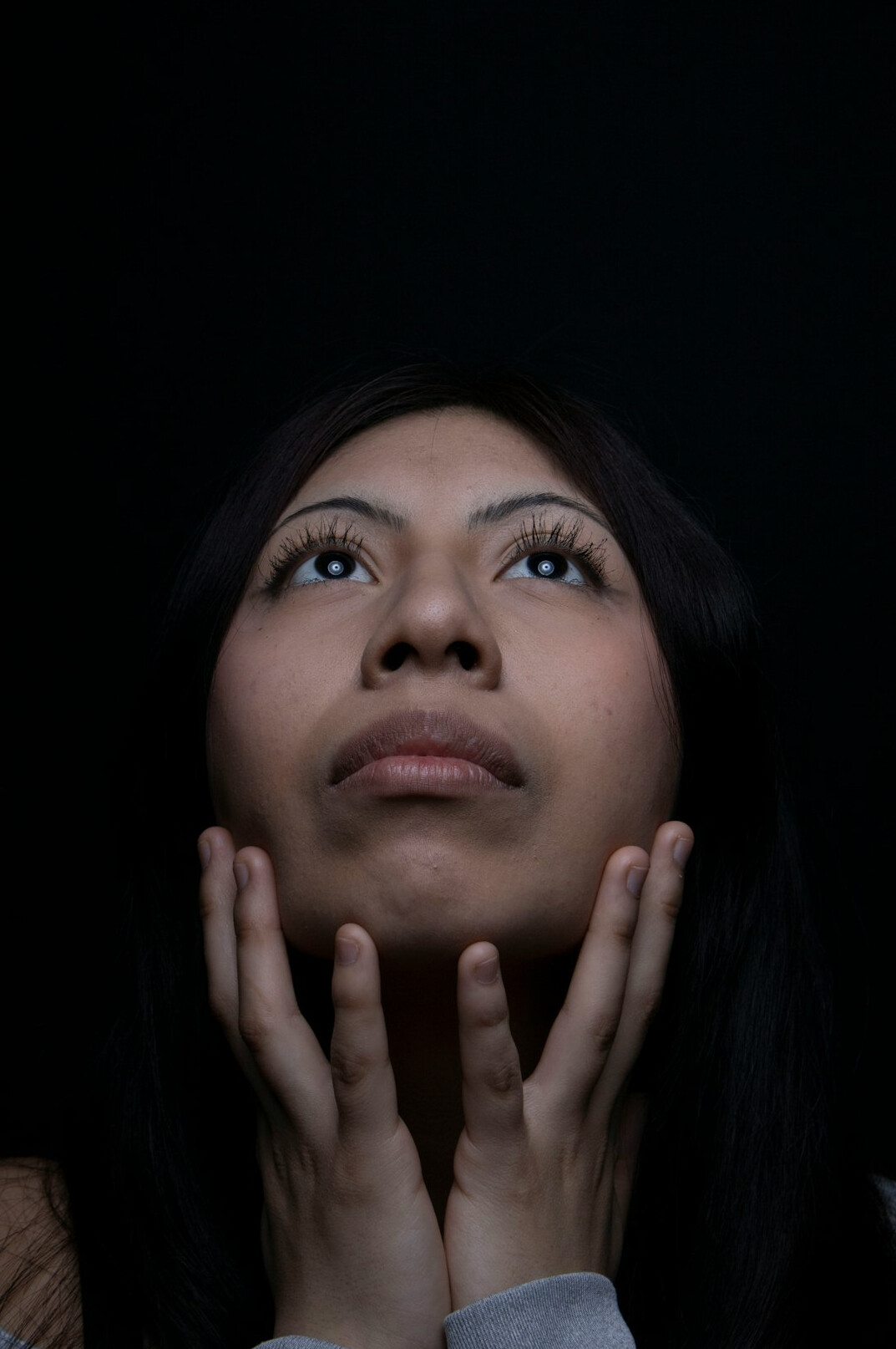 Studio portrait of a young Hispanic woman researcher