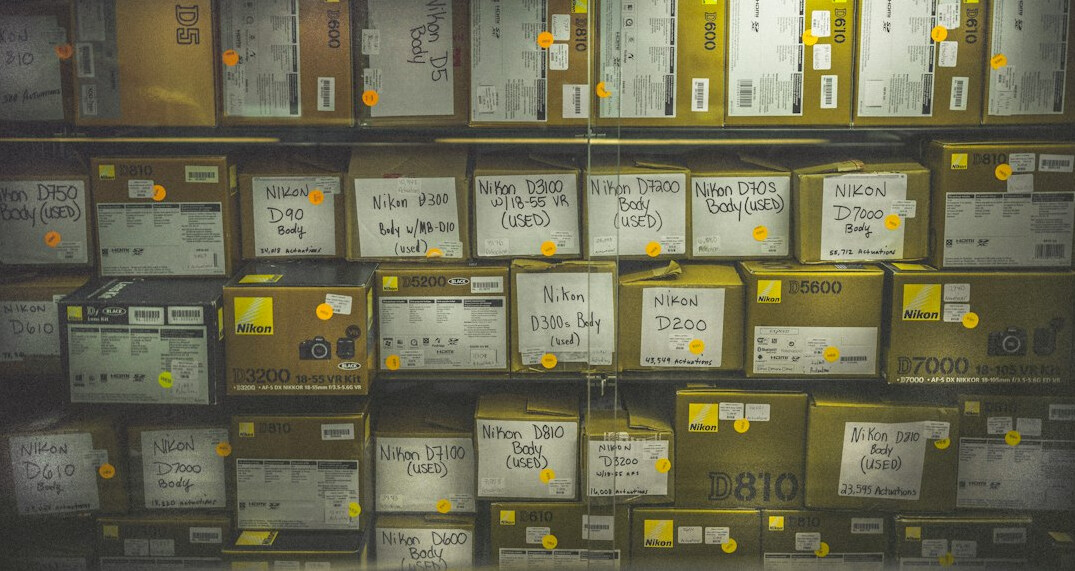 Archive shelves with labeled boxes and folders