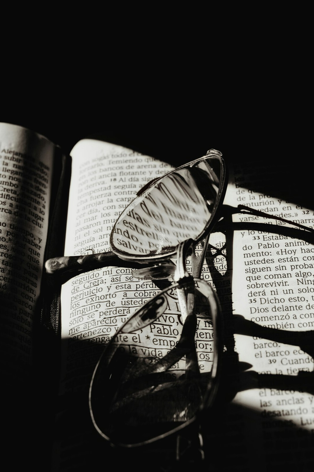 Magnifying glass over printed documents on a desk